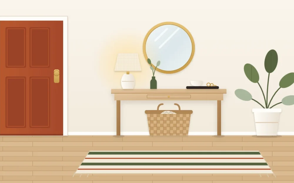 Welcoming entryway wall beside a terracotta front door with a slim oak console, lamp, round mirror, woven basket, plant and striped runner