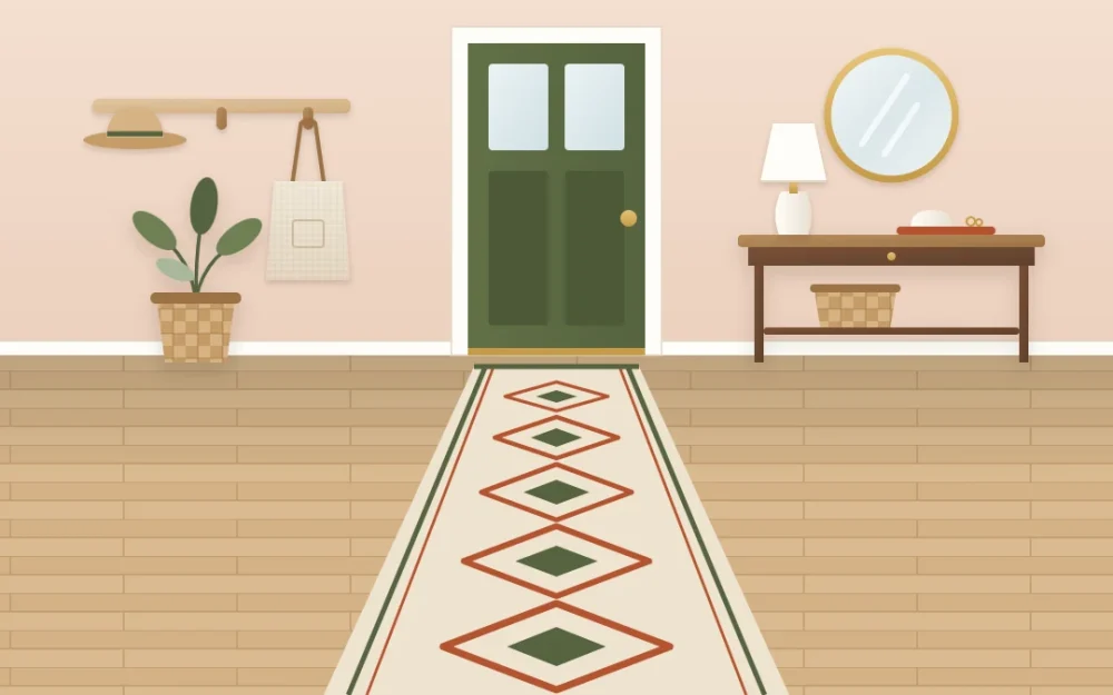 Long flat-woven runner with a diamond pattern leading from a front door past a console table, with an even border of wood floor on both sides