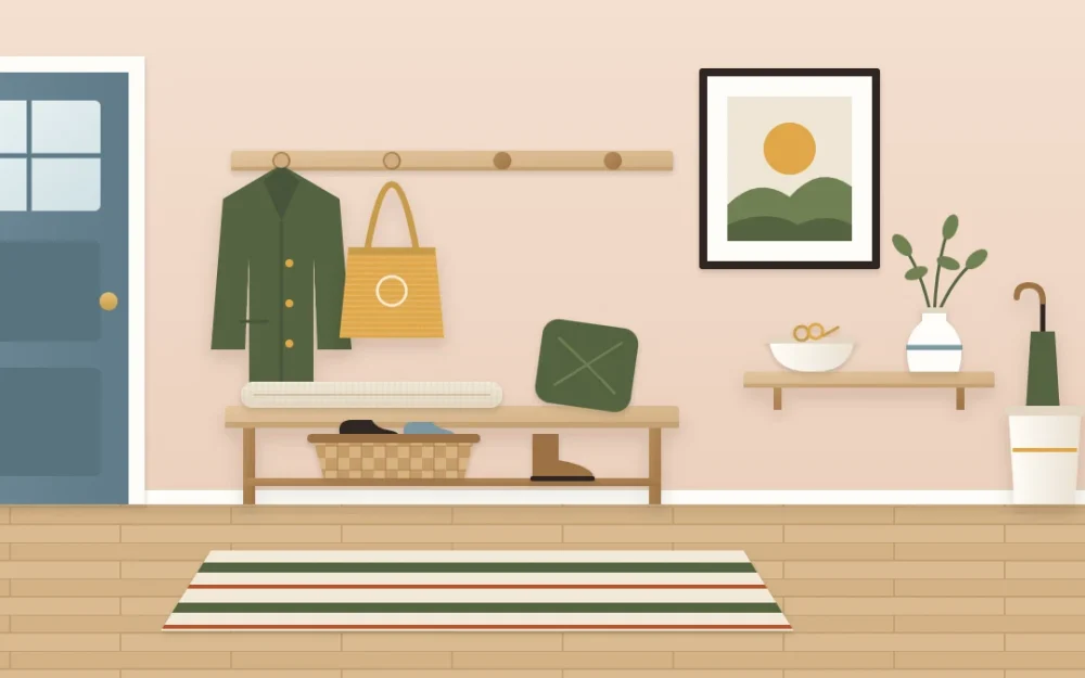 Entry wall mixing practical and decorative pieces: a bench with a cushion and basket, a peg rail with a coat and bag, a shelf with a key bowl and vase, and a framed print
