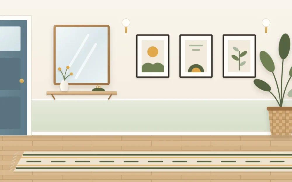 View along a narrow entry hall with a shallow wall ledge and vase, a rectangular mirror, three framed prints in a row, a long runner and a plant at the far end